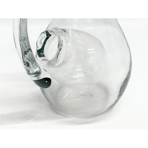 231 - An Early 20th Century French glass water jug with ice chamber. 19x27cm