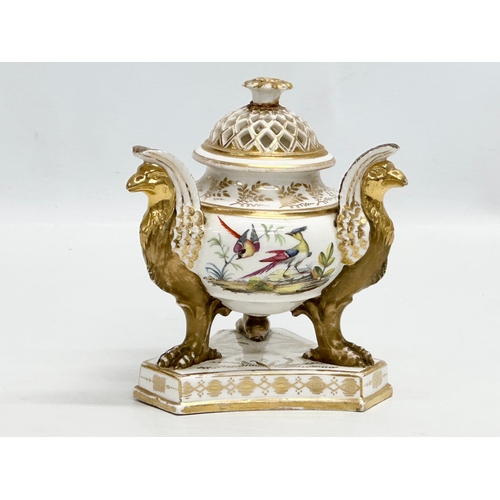 2 - An Early 19th Century gilt porcelain potpourri vase with cover. Raised on 3 griffins on a flat base,... 