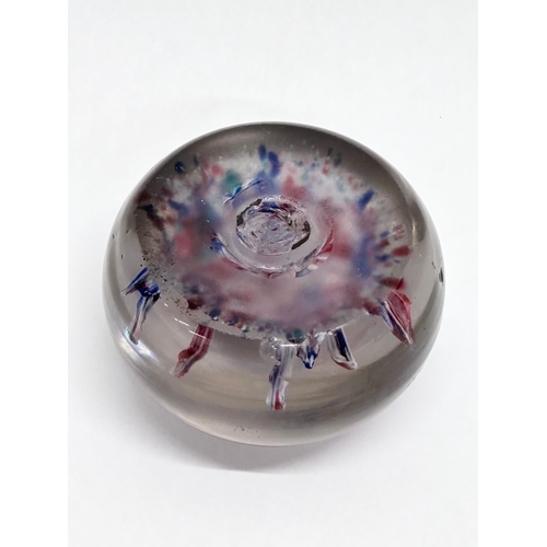 100 - A large 19th Century glass paperweight. 9x6.5cm.