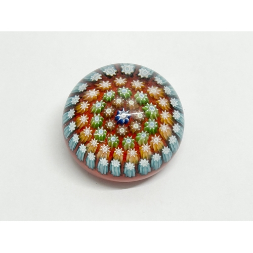 112 - A Murano glass millefiori paperweight. 4.5x3.5cm