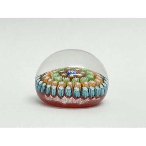 112 - A Murano glass millefiori paperweight. 4.5x3.5cm