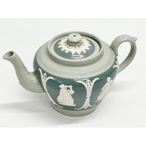 192 - James Dudson. A Late 19th Century moulded relief teapot. 22x13x11cm.