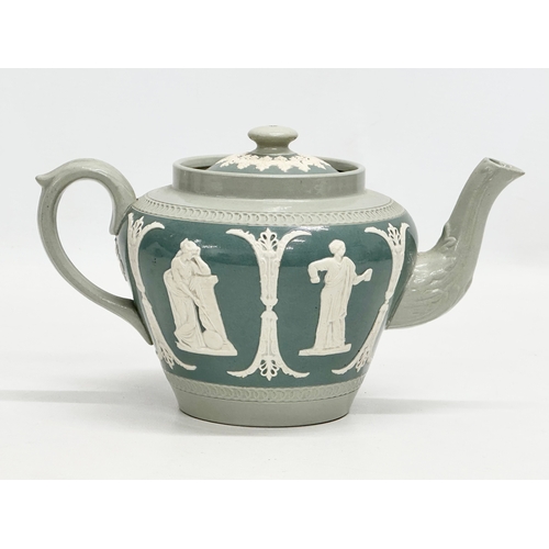 192 - James Dudson. A Late 19th Century moulded relief teapot. 22x13x11cm.