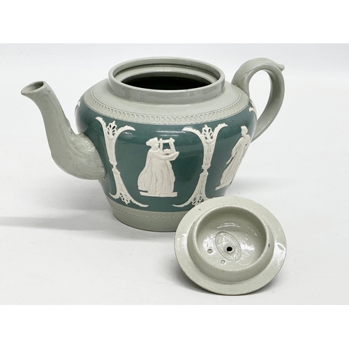 192 - James Dudson. A Late 19th Century moulded relief teapot. 22x13x11cm.