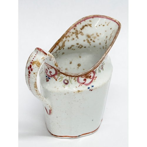 179 - A Late 18th Century English soft paste cream jug by New Hall. Circa 1780.