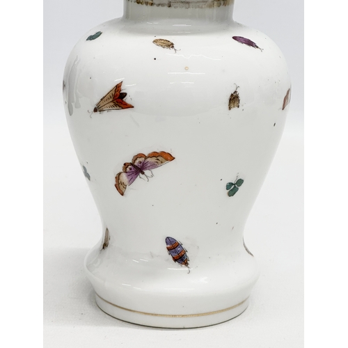 178 - A 19th Century peacock and butterfly jar with golden anchor mark. 21cm