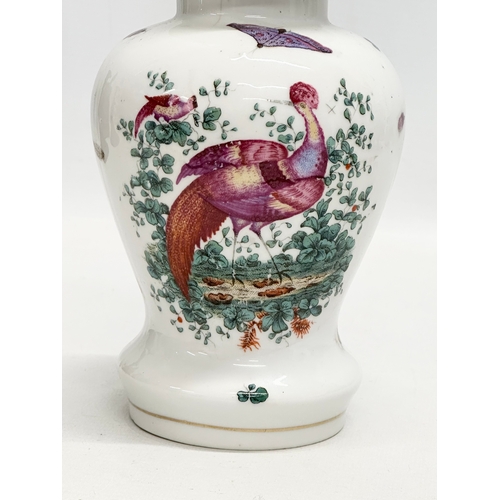 178 - A 19th Century peacock and butterfly jar with golden anchor mark. 21cm