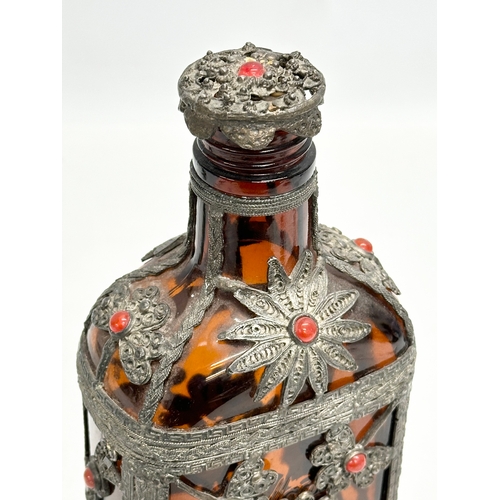 96 - George Ballantine & Son. A usual George Ballantine Whisky bottle with a Moroccan style silver overla... 