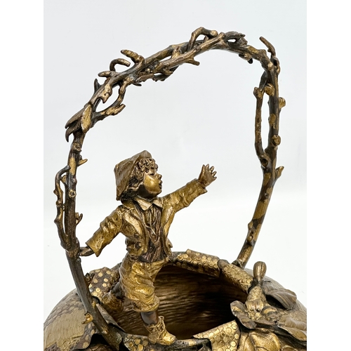 9 - A large 19th Century, French bronze and gilt spelter sculpture/basket, with playing boy on a branch ... 