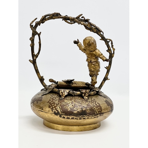 9 - A large 19th Century, French bronze and gilt spelter sculpture/basket, with playing boy on a branch ... 