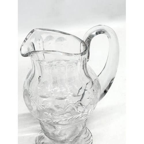 235 - Webb Crystal. A good quality Mid 20th Century glass water jug with engraved ferns and flowers. Marke... 