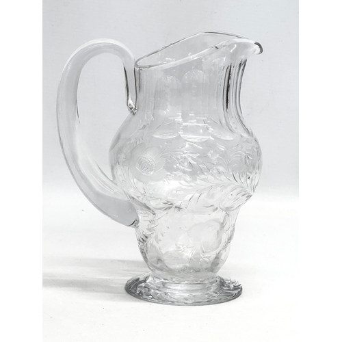 235 - Webb Crystal. A good quality Mid 20th Century glass water jug with engraved ferns and flowers. Marke... 