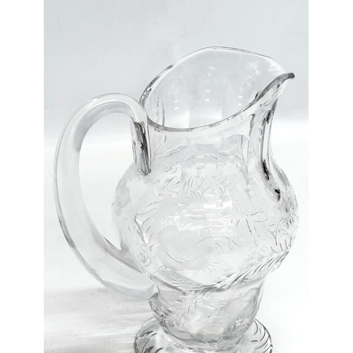 235 - Webb Crystal. A good quality Mid 20th Century glass water jug with engraved ferns and flowers. Marke... 