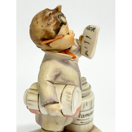 555 - A West German M.J. Hummel Goebel Pottery figurine. Little Pharmacist. 14cm