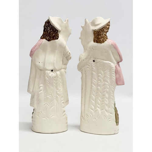 426 - A pair of 19th Century Victorian Staffordshire Pottery figures. 31cm