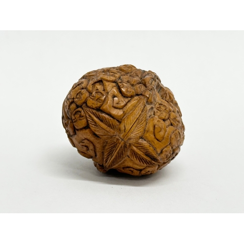 131 - A Late 19th Century Chinese Qing Dynasty carved Hediao walnut.