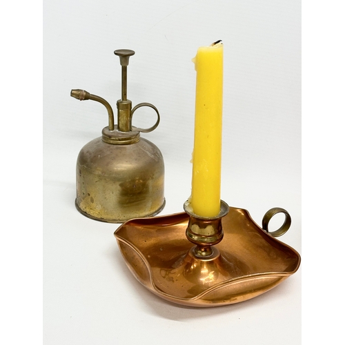 571 - A quantity of copper and brassware. Including an enamel measure and a brass measure. A copper chambe... 