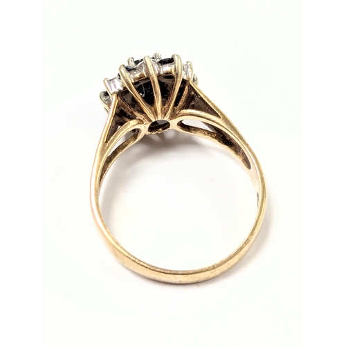 601 - A 9ct gold cluster ring. 4.5gr. Size UK P