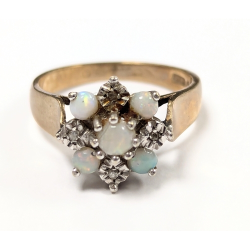 602 - A 9ct gold and opal cluster ring. 3.6g. Size UK N