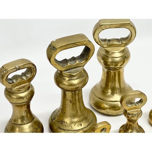 572 - Large Victorian heavy brass weights. 18cm. 15cm. 12cm