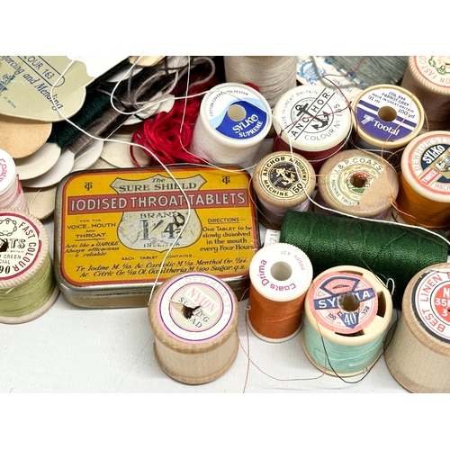 561 - A large quantity of vintage sewing equipment. J.P. Coats, Sylko, Clark & Co, Sylvia. Silk reels, but... 