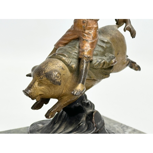 5 - Franz Bergmann. An Early 20th Century bronze “On A Pigs Back” figurine. Signed. On a marble base. Bo... 