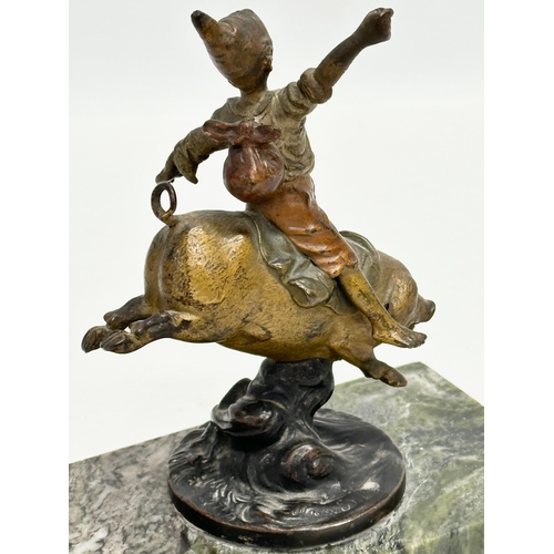 5 - Franz Bergmann. An Early 20th Century bronze “On A Pigs Back” figurine. Signed. On a marble base. Bo... 