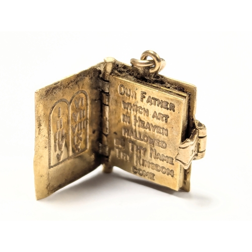 612 - A 9ct gold pendant in the form of the Bible. 6g.