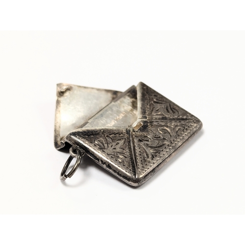 625 - An Early 20th Century silver stamp holder / pendant.