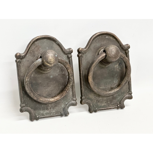 237 - A set of Early/Mid 20th Century bronzed brass door pulls and matching door knocker. 12x18cm. 16cm