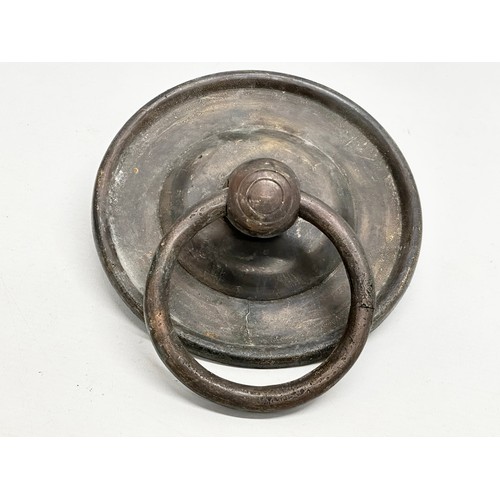 237 - A set of Early/Mid 20th Century bronzed brass door pulls and matching door knocker. 12x18cm. 16cm