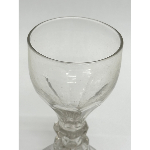 240 - An 18th Century George II wine glass/rummer with moulded stem. Circa 1727-1760. 13cm.