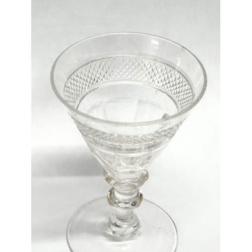 241 - An Early 19th Century Irish diamond and slice cut port glass. Circa 1800/1810. 6.5x10cm.