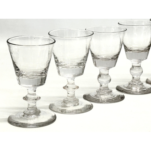 245 - A set of ten 18th Century George III glass wine glasses/rummers. Circa 1760-1780. 11cm. 10cm.