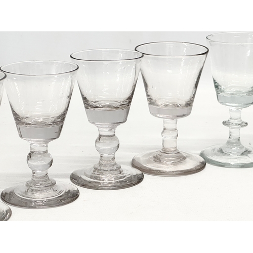 245 - A set of ten 18th Century George III glass wine glasses/rummers. Circa 1760-1780. 11cm. 10cm.