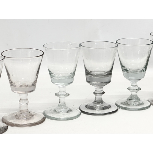 245 - A set of ten 18th Century George III glass wine glasses/rummers. Circa 1760-1780. 11cm. 10cm.