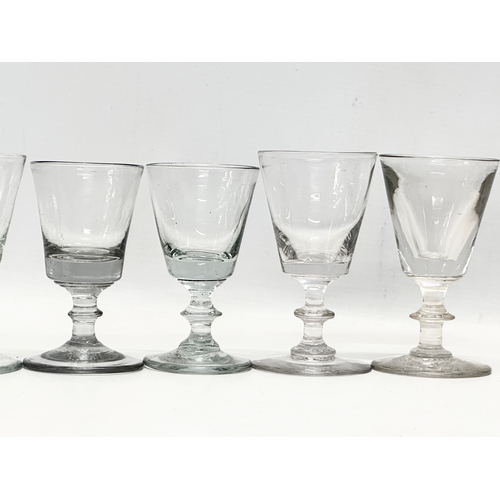 245 - A set of ten 18th Century George III glass wine glasses/rummers. Circa 1760-1780. 11cm. 10cm.