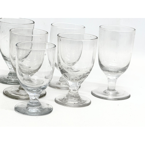 253 - A set of 6 Mid 19th Century Victorian glass rummers/gin glasses. 11.5cm. 10.5cm. 9.5cm.