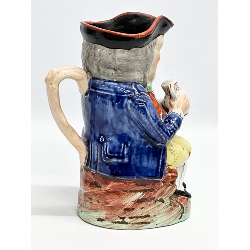 394 - Two 19th Century toby jugs. A Late 19th Century “Squire” toby jug. With a Mid 19th Century Staffords... 