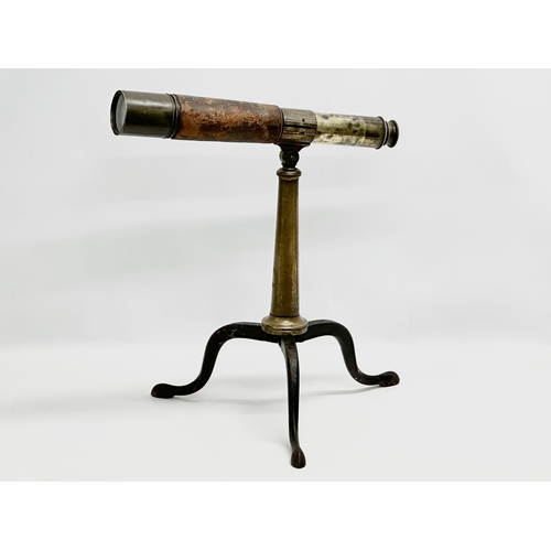 41 - Watson & Sons. A 19th Century 5 draw brass and leather bound telescope on a brass and iron tripod ba... 