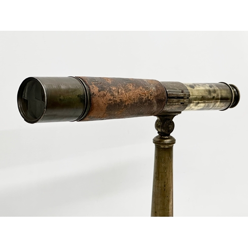 41 - Watson & Sons. A 19th Century 5 draw brass and leather bound telescope on a brass and iron tripod ba... 