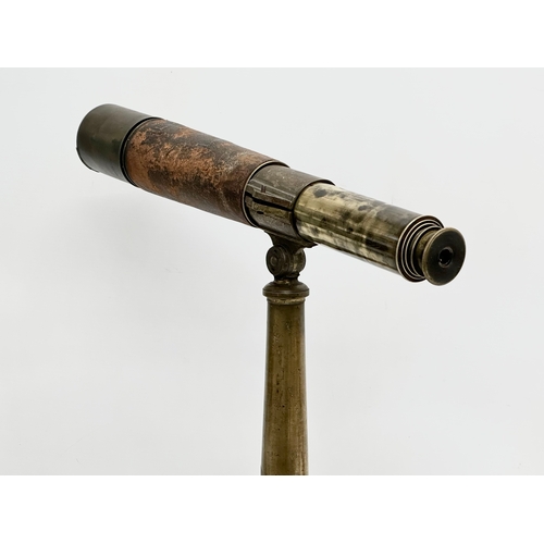 41 - Watson & Sons. A 19th Century 5 draw brass and leather bound telescope on a brass and iron tripod ba... 