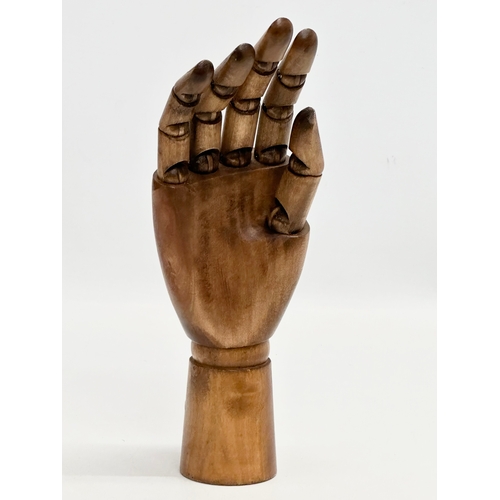 562 - A vintage wooden ring display hand. 25cm