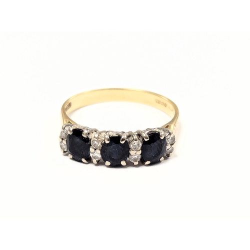 651 - An 18ct gold sapphire and diamond ring. UK size N