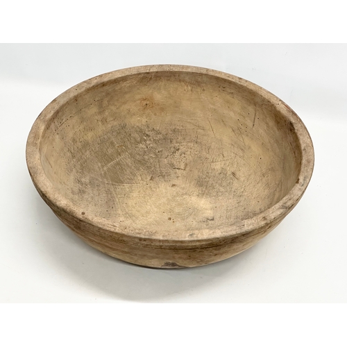 43 - A large Late 19th Century Irish butternut dough bowl. 47x14cm.