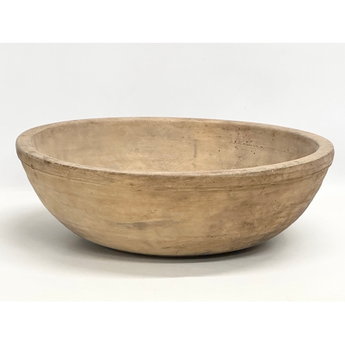 43 - A large Late 19th Century Irish butternut dough bowl. 47x14cm.