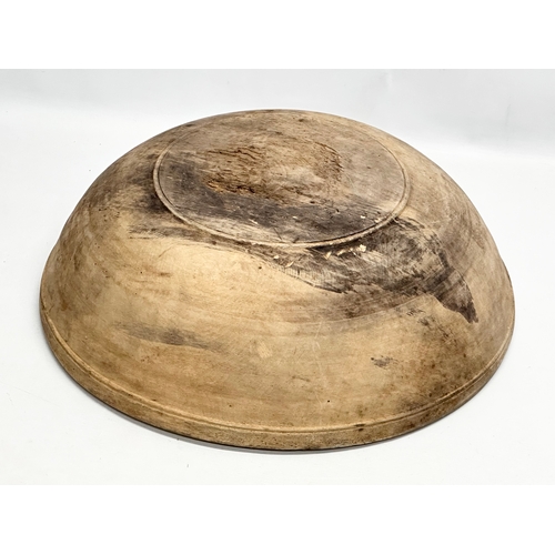 43 - A large Late 19th Century Irish butternut dough bowl. 47x14cm.