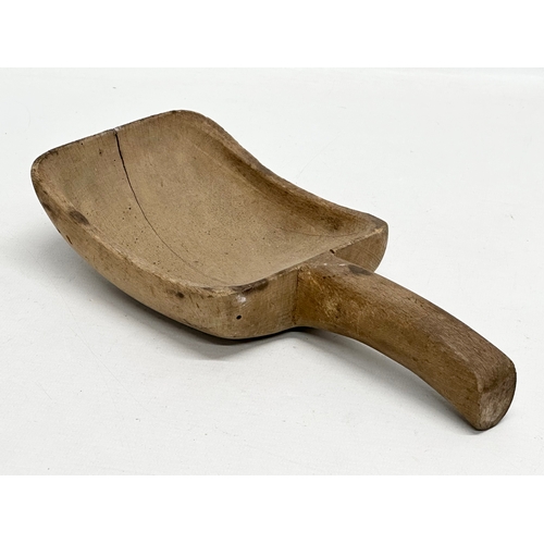 44 - A Late 19th Century Irish butternut bowl, together with an Irish butter stamp pad and flour scoop. B... 