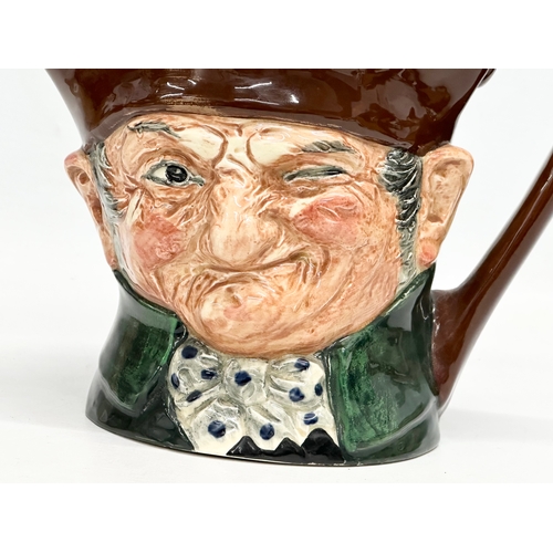 568 - A rare Thorens Swiss Movement. A Royal Doulton “Old Charley” musical character jug. 19x13x15cm.