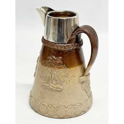 574 - Silver mounted. A Late 19th Century Lambeth jug, with London mark and Prince of Wales Feathers. 15cm